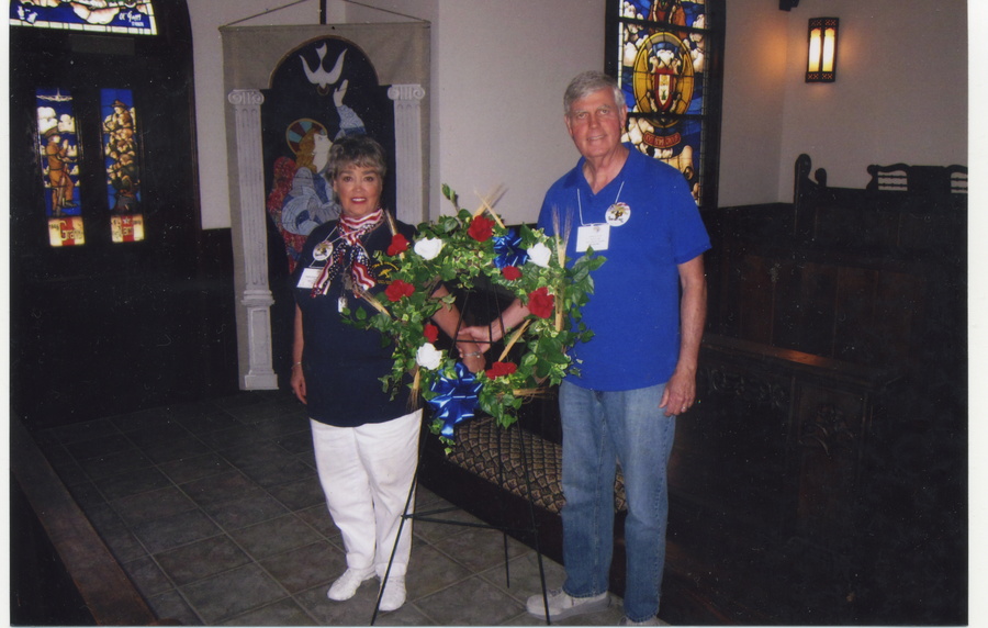 Robbie Sarnow and husband preparing the wreath in 8thAF Museum